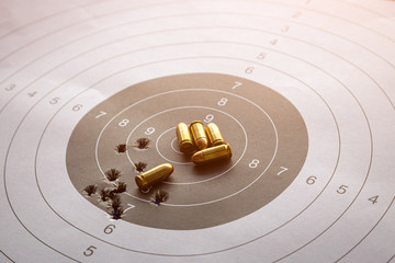 bullets on paper target for shooting practice