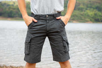 Asia man in bermuda shorts and t-shirt, outdoor activity concept