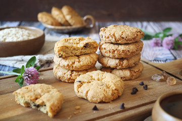 Oatmeal cookies with chocolate drops and cup of coffee