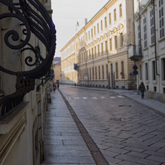 typical Italian-style paved street with wrought-iron railings