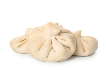 Uncooked dumplings on white background