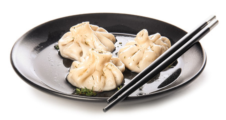 Plate with tasty dumplings on white background