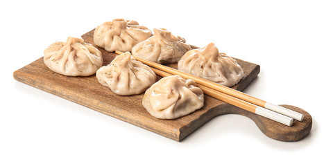 Fototapeta na wymiar Board with tasty dumplings on white background