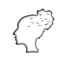 White paper head of a young beautiful girl, pattern with black silhouettes of birds. The dream of freedom, longing, melancholy. The wind in your hair. Romantic mood, autumn.
