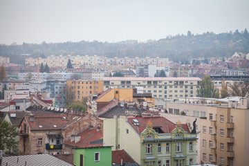 Fototapeta premium Panorama of Czech brutalist buildings, called Panelaky, in the suburbs of Brno, Czechia, during a rainy afternoon. They are symbols of communist architecture and part of the residential industry