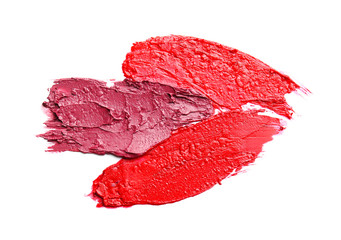 Strokes of bright lipsticks on white background