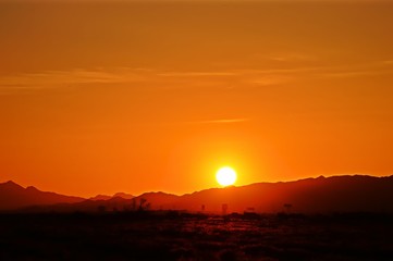 Obraz na płótnie Canvas View Of Sunset Over Mountain Range