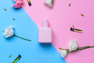 Beautiful composition with perfume bottle on color background