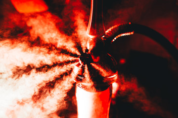 Blowing out steam out of shisha release valve, round steam flows of shisha