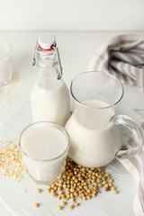 Different milk on white table