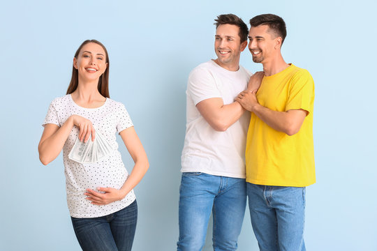 Gay couple and pregnant woman with money on color background