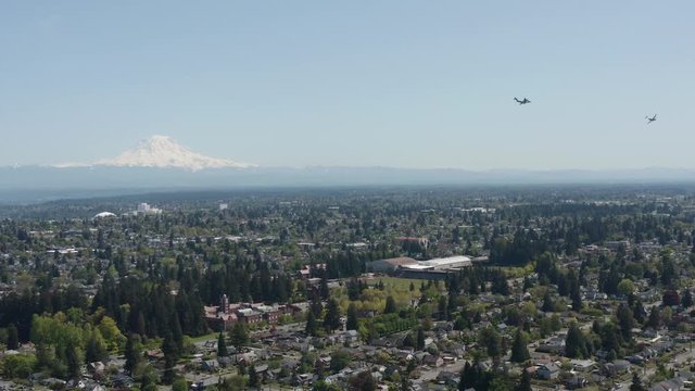 Boeing C17 Globemaster Aircrafts Flying Over Tacoma, Washington Under The Clear Blue Sky - aerial wide shot