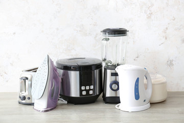 Different household appliances on table