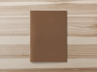 Craft Magazine or Brochure on brown wooden background. Front cover top view. Template concept for your showcase.
