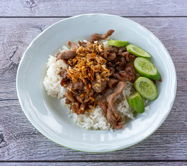 Pork fried in garlic on rice 