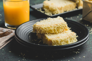 Freshly baked Taisan Cake Loaf (Sponge/ Chiffon Cake) with mango juice on the side- Side View