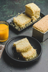 Freshly baked Taisan Cake Loaf (Sponge/ Chiffon Cake) with mango juice on the side- Top View Vertical