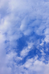 a photo of a cloud in the bright blue sky in the morning, looking very beautiful and charming.