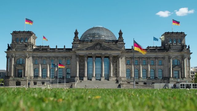 German parliament building exterior on a sunny day. Low angle zoom in time lapse
