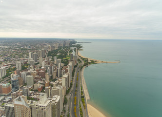 Aerial view of Chicago, with Lincoln Park in the background. Sky full of clouds and beautiful colors.