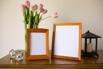 Home concept, stylish blank picture frames for loved ones or vacation photos