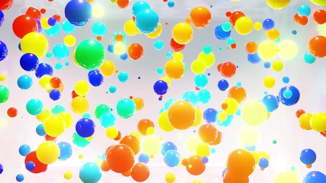 Abstract composition of colorful balls in air, which randomly light up and reflect in each other. Multicolored spheres in air as simple geometric light background with light effects in ligth room