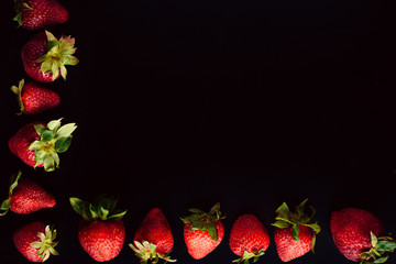 strawberry fruit frame. black background. free space