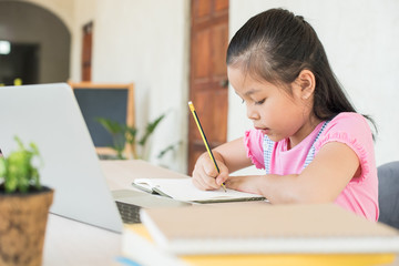 asian girl student online learning study online with video call teacher. social distance during quarantine, self-isolation, online education concept, homeschool, stay at home entertainment.