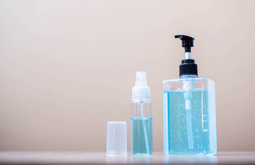 wash hand alcohol gel and spray or sanitizer bottle on wooden table background, prevent coronavirus or Corona Virus Disease. Disinfectant, Antiseptic, personal hygiene, new normal and Health concept