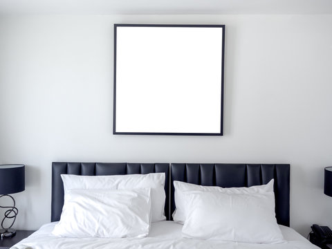 Blank photo square frame in bedroom.