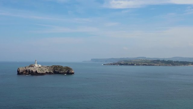 View to the Island with a Beacon in the Ocean in Parque de La Magdalena, Santander, Spain