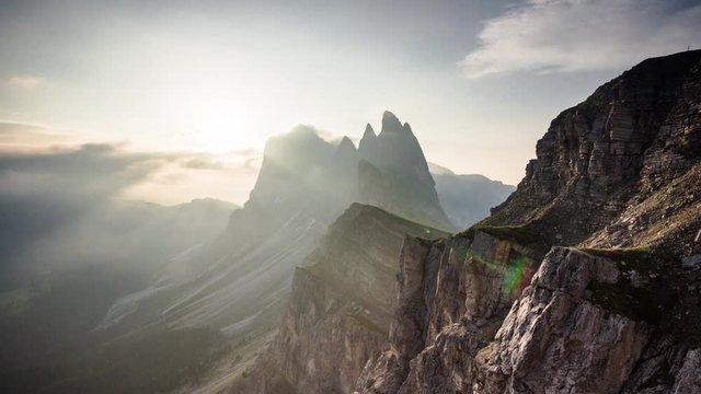 Time lapse sunrise over Seceda mountain ridge in Dolomites, Italy. Morning golden hour cloudscape over famous South Tyrol Alps, Val di Funes valley landmark
