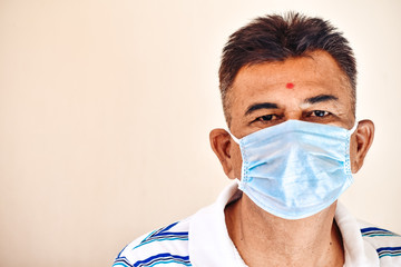 Portrait of an Indian man wearing medical mask during the coronavirus pandemic