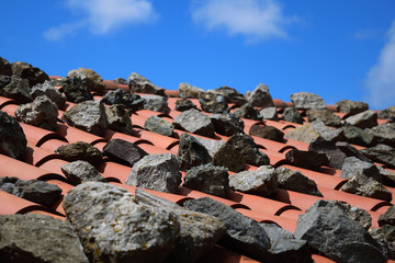 Stones used to secure the roof against strong winds - old town Chora, Samothraki island, Greece, Aegean sea