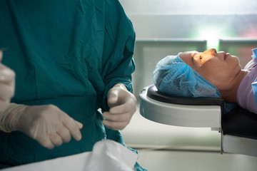 Obraz na płótnie Canvas Senior Asian woman in operating theater ready for glaucoma surgery