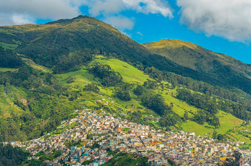 Cityscape of a district in Quito built on the Pichincha Volcano at Sunrise, Ecuador.