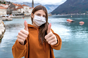 Lockdown is over concept. Woman in mask can travel safe. We back to normal life. Coronavirus ended.