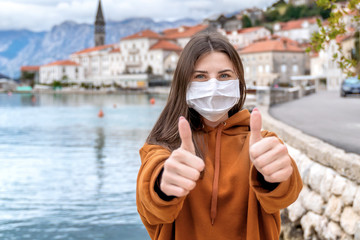 Lockdown is over concept. Woman in mask can travel safe. We back to normal life. Coronavirus ended.