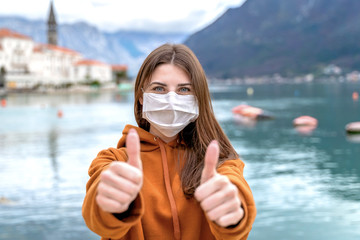 Lockdown is over concept. Woman in mask can travel safe. We back to normal life. Coronavirus ended.