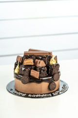 sweet triple chocolate cake with decoration on white background