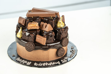 sweet triple chocolate cake with decoration on white background