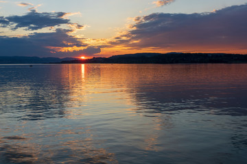 Stunning sunset on the shores of the Upper Zurich Lake (Obersee), near Rapperswil, St. Gallen, Switzerland