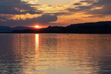 Stunning sunset on the shores of the Upper Zurich Lake (Obersee), near Rapperswil, St. Gallen, Switzerland
