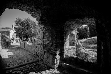 Fototapeta premium the walls of the ruined fortress and the stones from which it is made