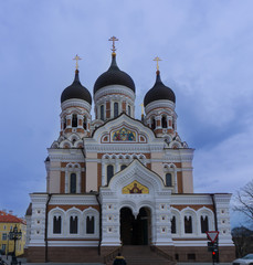 Fototapeta na wymiar White young tourist man looking at Alexander Nevsky Cathedral in Tallinn old town, Estonia, Europe