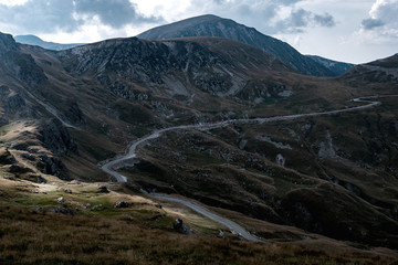 the road among the fir trees seen from above on the mountain