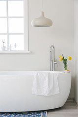 Interior of bathroom with fresh flowers