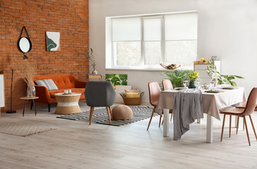 Interior of modern stylish dining room with floral decor