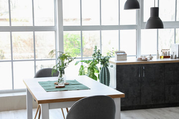 Interior of modern stylish dining room with floral decor