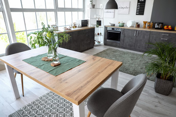 Interior of modern stylish dining room with floral decor